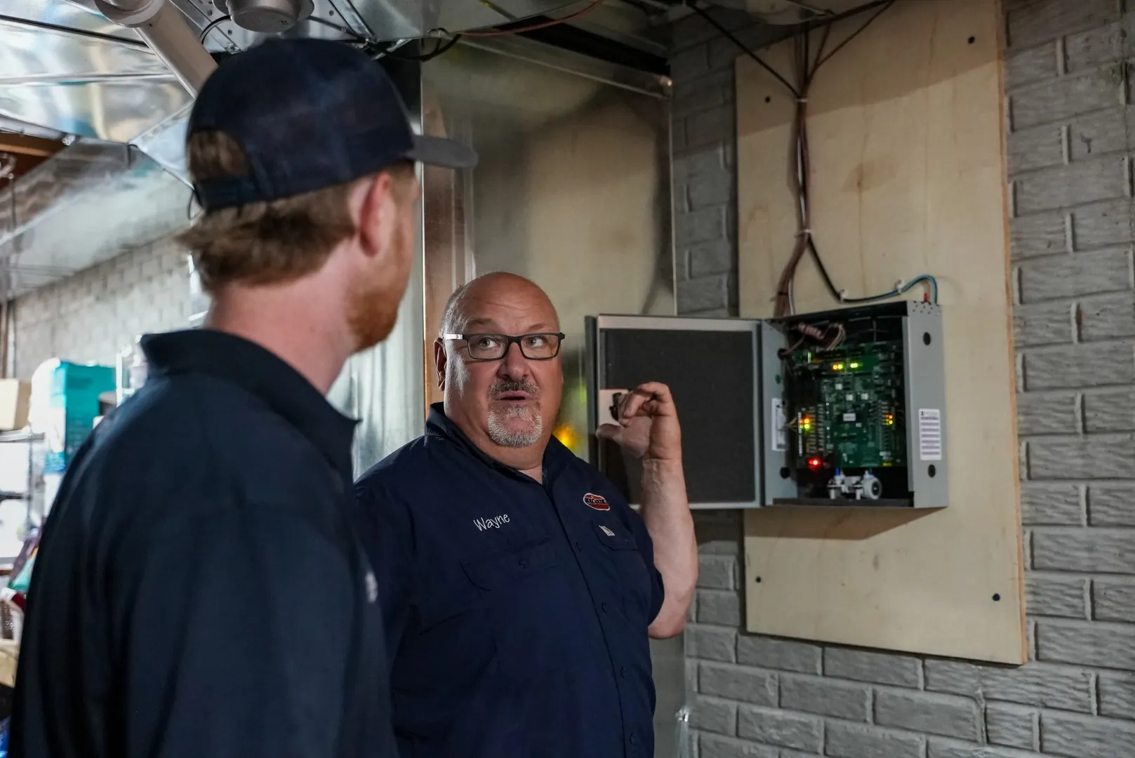 Technician with ductless HVAC equipment